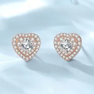 Macro shot of S925 silver heart stud earrings with rose gold finish and pavé zircon stones