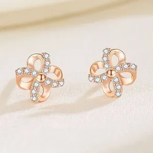 Detail of rose gold S925 sterling silver four-leaf clover earrings with white zircon pavé