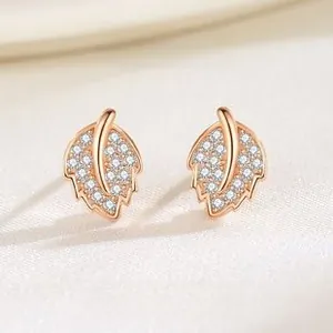 Detail showing S925 silver leaf earrings with rose gold plating and white zircons