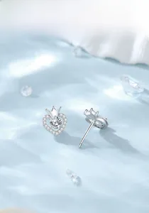 Detail of S925 sterling silver heart crown stud earrings with sparkling cubic zirconia