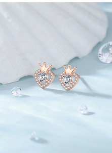 Close-up of S925 silver crown heart stud earrings in rose gold with sparkling crystals