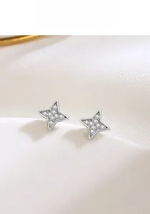 Close-up of S925 sterling silver four-pointed star stud earrings with pavé zircons