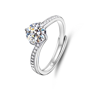 Detailed macro view of 1 carat moissanite ring with twisted silver band and pave accents