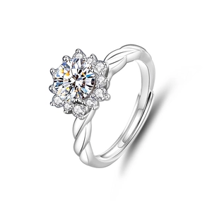 Detail of Moissanite sunflower ring featuring halo setting and twisted silver band