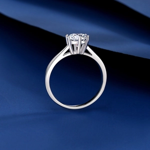 Classic S925 sterling silver six-prong moissanite engagement ring on blue silk background