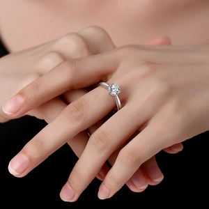Classic 925 sterling silver four-prong solitaire engagement ring worn on a finger