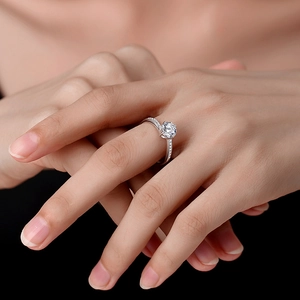 Elegant S925 silver moissanite ring with a twisted pavé band and round brilliant cut