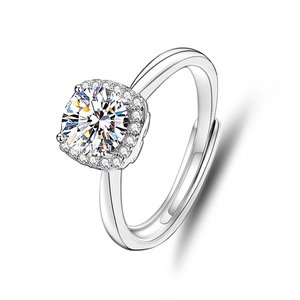 Macro shot of silver ring featuring a round moissanite in a square halo setting