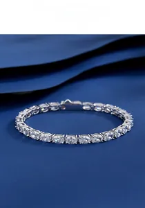 Detailed view of S925 sterling silver oval cut tennis bracelet on blue fabric