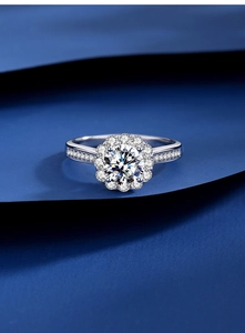Macro shot of S925 sterling silver moissanite sunflower engagement ring with side diamonds