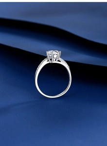 Macro shot of a 925 silver six-prong engagement ring with a round brilliant diamond