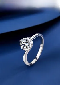 Detailed view of 1ct round moissanite ring with six-prong setting on polished silver band