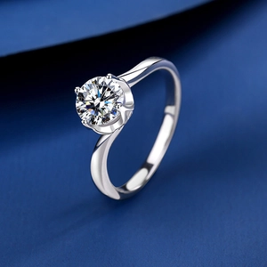 Classic 1 carat moissanite ring with four-prong setting and twisted silver band