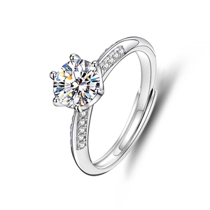 Macro shot of 925 sterling silver six-prong moissanite ring with side accent diamonds