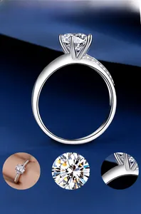 Detail of s925 silver six-prong solitaire ring with moissanite and pavé set diamond band