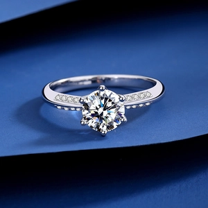 Luxurious S925 sterling silver ring with six-prong moissanite stone on blue background
