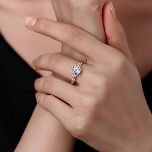 Elegant S925 sterling silver six-prong moissanite engagement ring on woman's finger