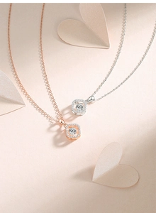 Detail of S925 silver four-leaf clover pendant with floating moissanite in halo square