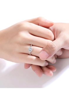 Close-up of elegant S925 silver moissanite halo engagement ring worn on hand