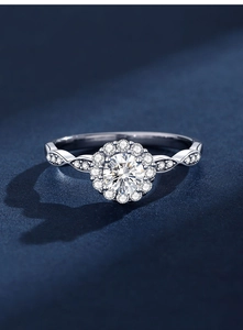 Macro detail of a 0.5 carat Moissanite ring with halo setting and twisted pave band