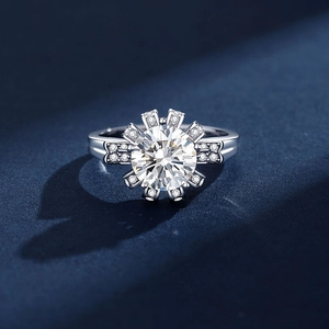 Luxurious S925 sterling silver ring with a large round moissanite in a starburst halo setting