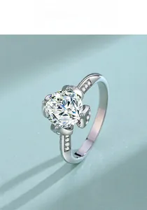 Side view of luxury S925 silver lotus ring with a brilliant two-carat moissanite stone