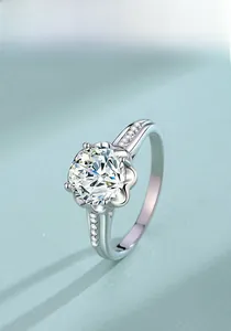 Detail of s925 silver ring featuring a six-petal flower setting with a 2ct moissanite stone