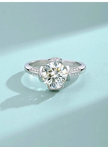 Close-up of S925 silver lotus ring with a 2-carat moissanite stone and side diamonds