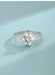 Macro detail of a classic six-prong S925 silver ring with a sparkling moissanite stone