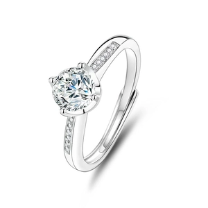 Macro shot of s925 silver moissanite ring featuring a four-claw setting and side stones