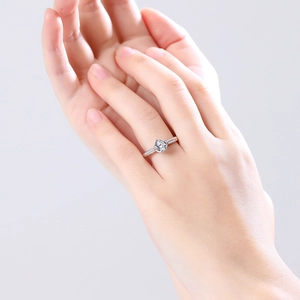 Classic S925 sterling silver moissanite engagement ring with side stones on hand