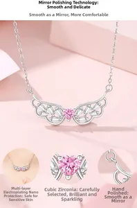 Detail view of 925 silver angel wing necklace with pink heart stone and cubic zirconia