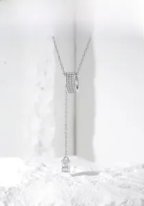 Macro shot of S925 silver Y-shaped necklace with micro-pave cylinder and rectangle crystal