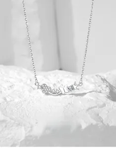 Close-up of S925 silver crown heart and butterfly pendant with sparkling cubic zirconia