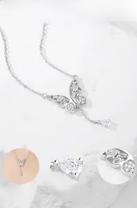 Macro de collier pendentif nœud en argent S925 avec zircons cubiques et détail de gland