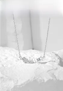 Detail of s925 silver crown and heart butterfly pendant with sparkling zircon accents