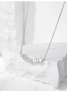 Macro shot of silver S925 heart crown necklace pendant with sparkling zirconia details