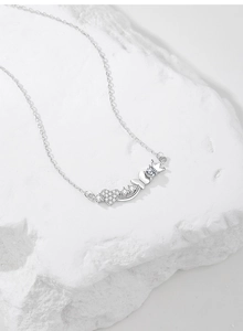 Detail of S925 silver necklace featuring crown, heart, and butterfly charms with zircons