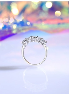 Macro side view of S925 sterling silver ring with five brilliant cut square stones