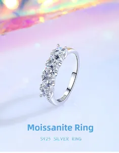 Close-up of S925 sterling silver ring featuring five prong-set round moissanite stones