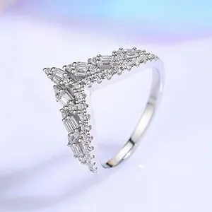 Close-up of S925 sterling silver V-shaped ring featuring baguette and round cubic zirconia