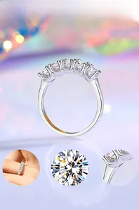 Macro details of S925 silver ring featuring five round-cut cubic zirconia with mirror polish