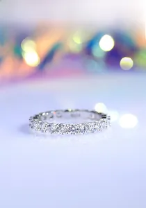 Macro shot of S925 sterling silver eternity ring with sparkling round-cut crystals