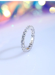 Macro shot of S925 sterling silver eternity ring featuring clear full pave crystals