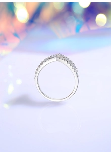 Macro shot of S925 sterling silver V-shape crown ring with sparkling pave crystals