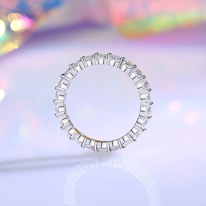Sparkling S925 sterling silver eternity ring with round-cut pavé diamonds on purple base