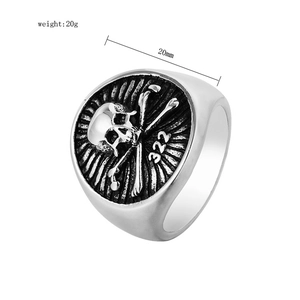 Detailed top view of retro punk skull and bones 322 engraving on a 20mm men's steel ring