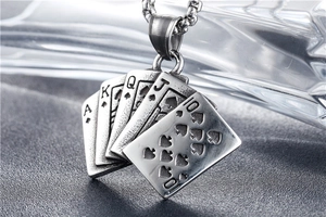 Macro detail of retro royal flush poker pendant with aged stainless steel finish