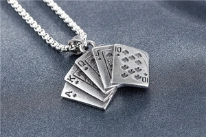 Macro shot of vintage titanium steel ace of spades poker royal flush necklace pendant