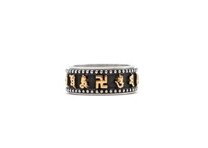 Detailed close-up of a rotating titanium steel ring with engraved religious mantra symbols